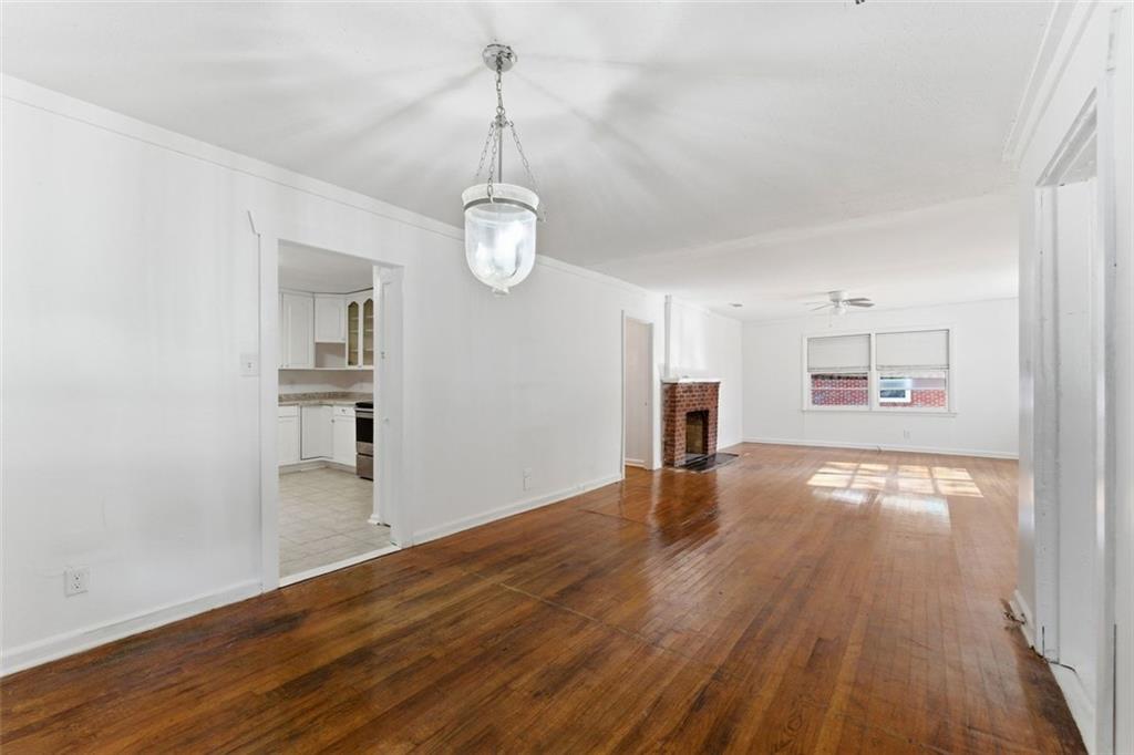 1431 Sharon Street Northwest Atlanta, GA 30314 - Photo 39 of 44 a view of empty room with wooden floor and fan