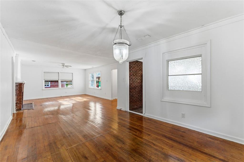 1431 Sharon Street Northwest Atlanta, GA 30314 - Photo 40 of 44 a view of empty room with wooden floor and fan
