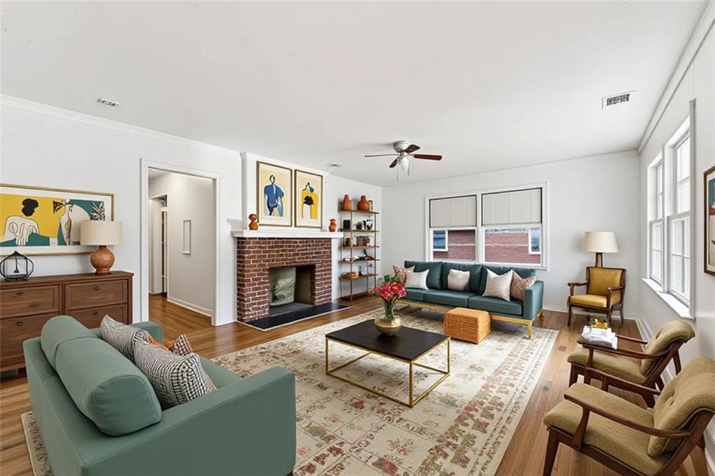 1431 Sharon Street Northwest Atlanta, GA 30314 - Photo 5 of 44 a living room with furniture and a fireplace