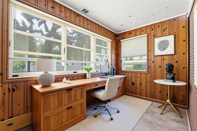 a view of empty room with a fireplace