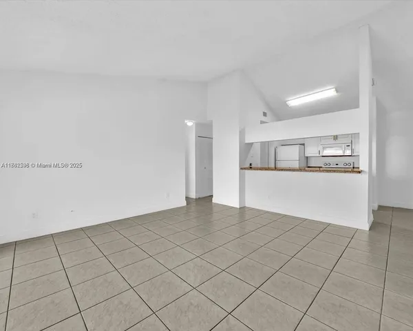 a bathroom with a granite countertop sink a large mirror and a