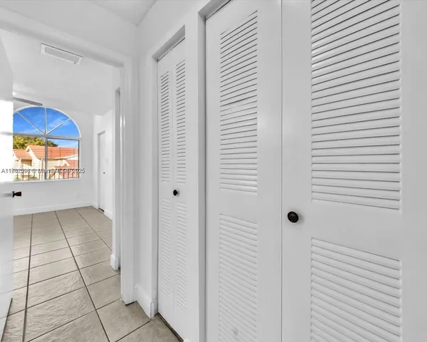 a view of a hallway with closet