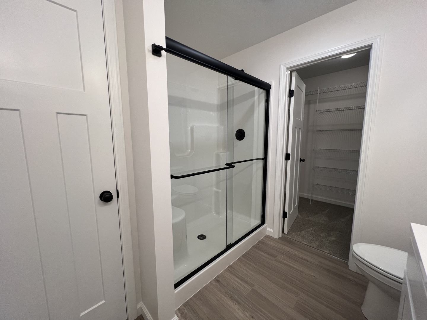 14 Eric Court Bloomington, IL 61705 - Photo 11 of 22 a bathroom with a glass shower door and mirror