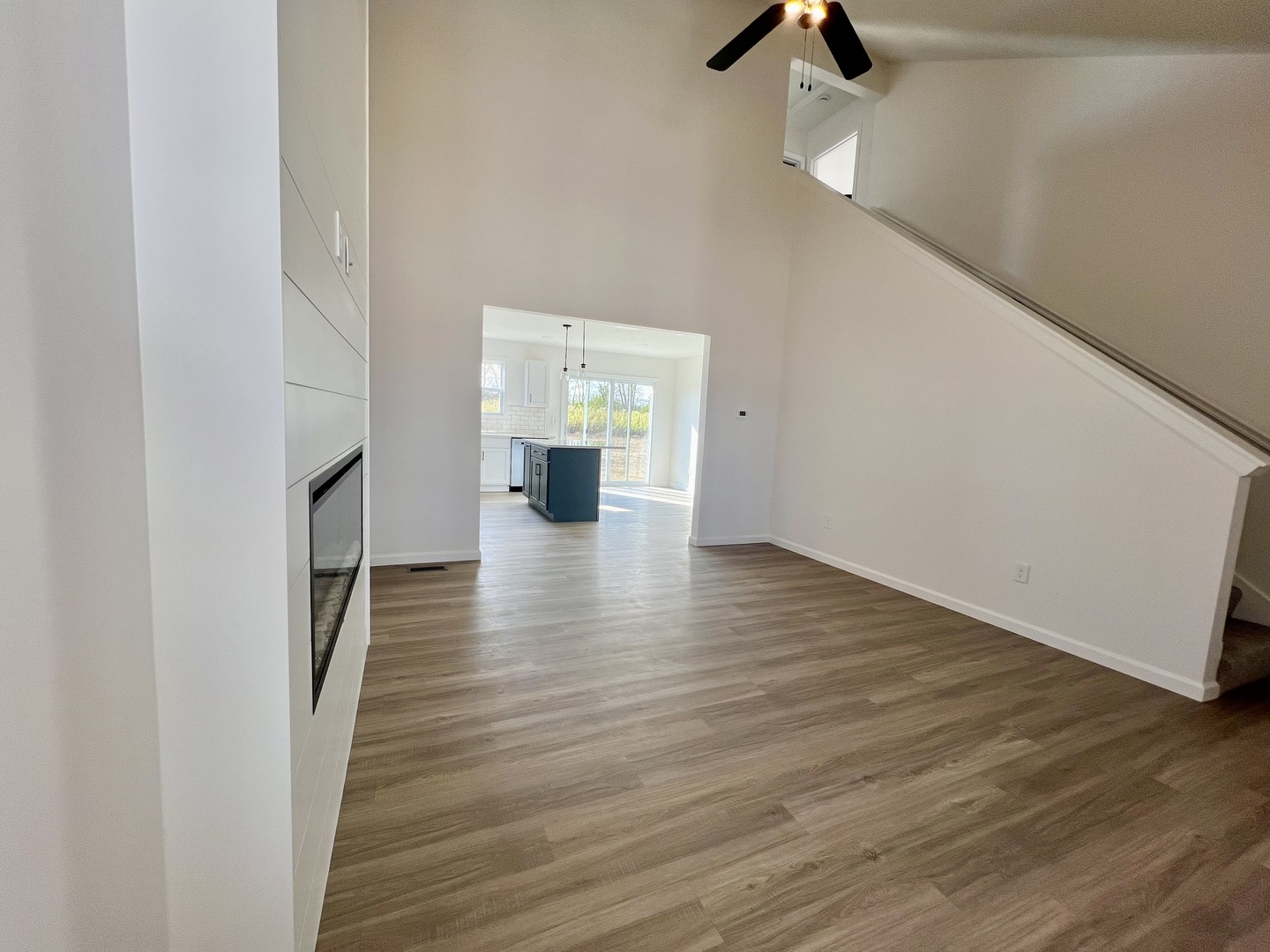 14 Eric Court Bloomington, IL 61705 - Photo 2 of 22 a view of an empty room with wooden floor and a window