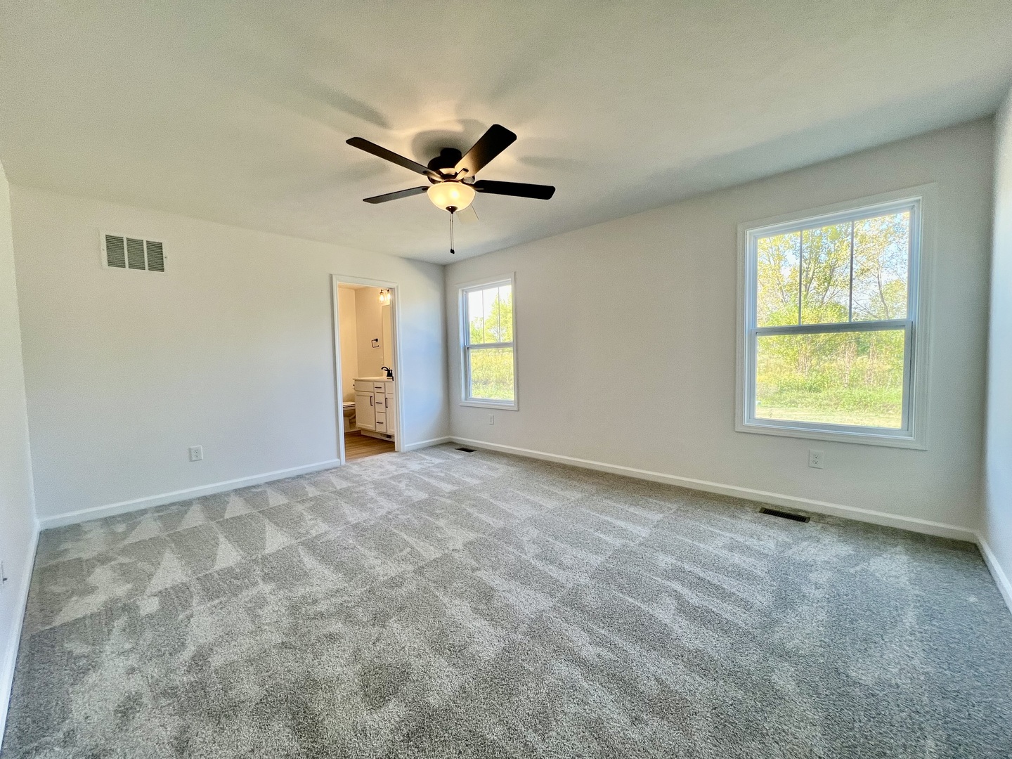 14 Eric Court Bloomington, IL 61705 - Photo 9 of 22 a view of an empty room with a window