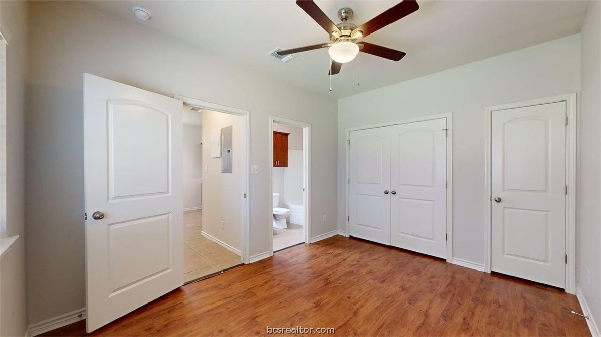 4453-4455 Reveille Road College Station, TX 77845 - Photo 9 of 37 an empty room with wooden floor and ceiling fan