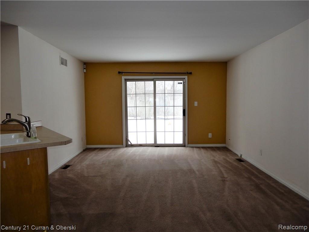 3500 West Seven Mile Road Detroit, MI 48221 - Photo 2 of 23 Large living room with door-wall to patio