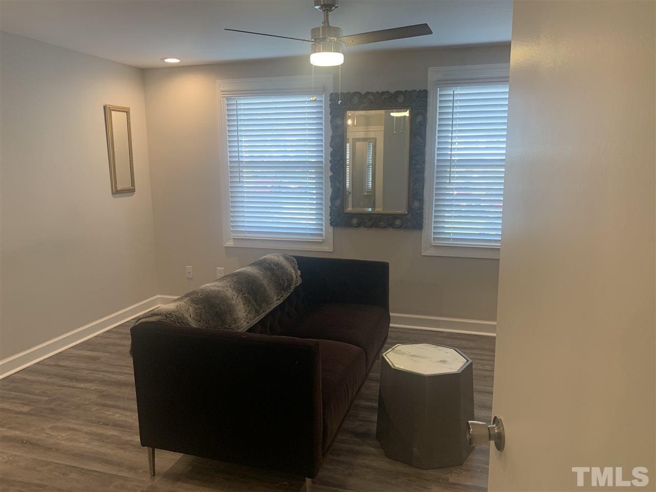 7731 Kelley Court Raleigh, NC 27615 - Photo 6 of 14 a living room with furniture and a window