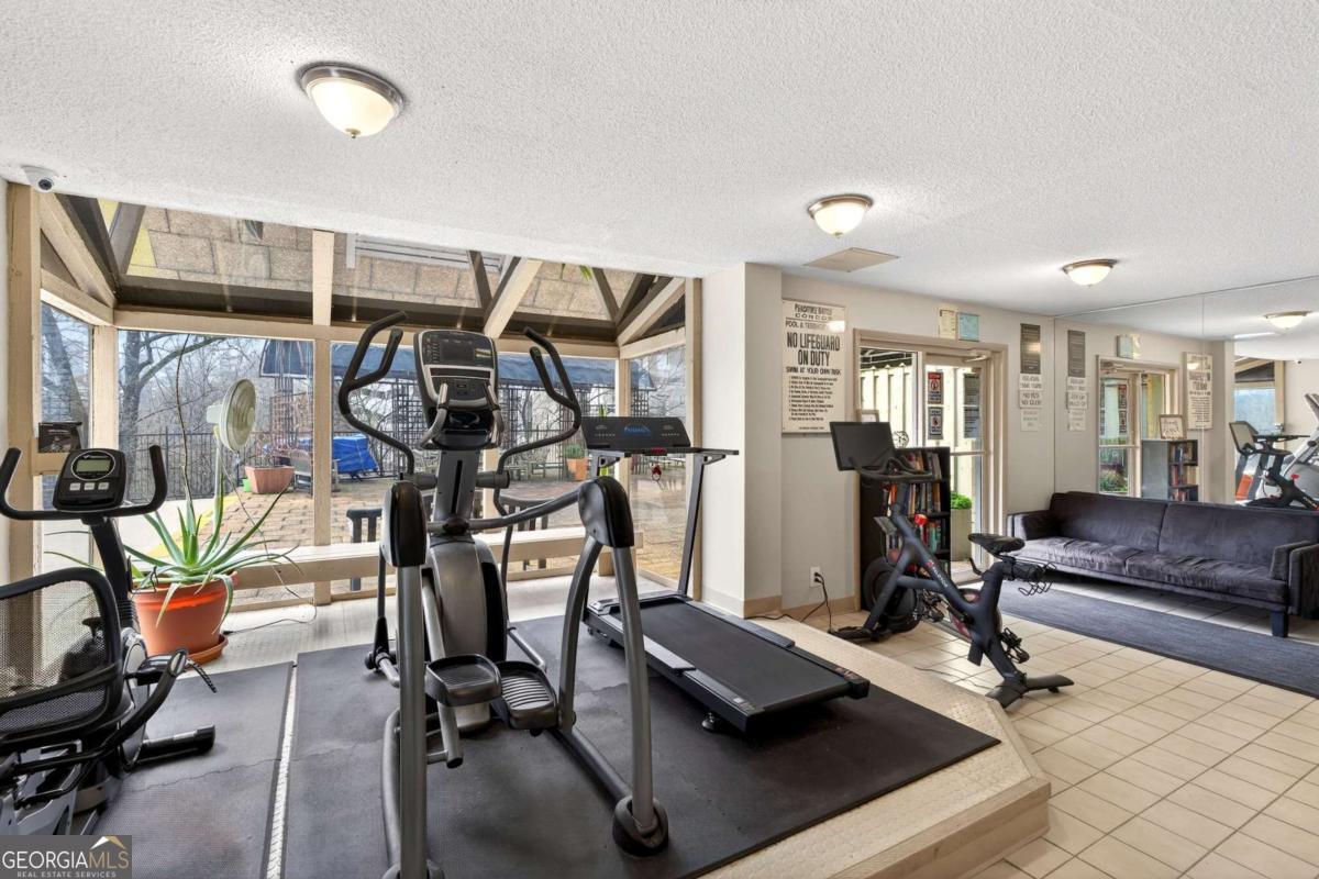 2285 Peachtree Road, Unit 1106 Atlanta, GA 30309 - Photo 21 of 27 a view of a room with gym equipment