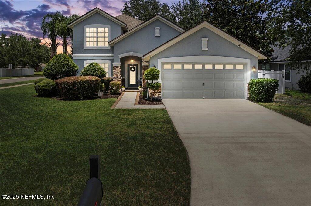 a front view of a house with a yard