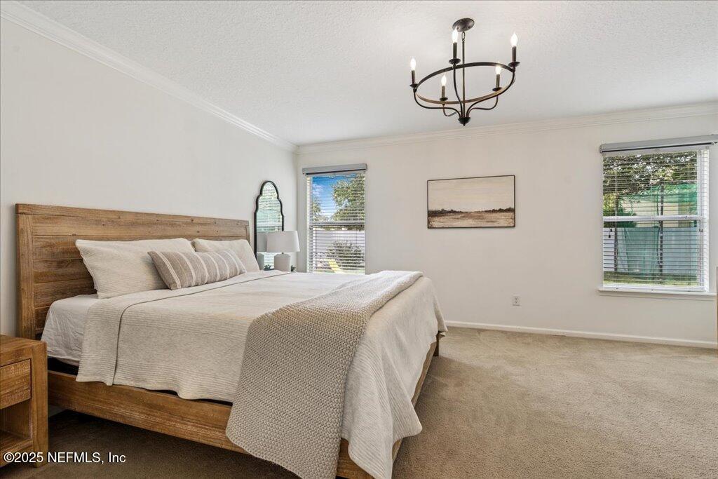 800 Marjories Way St. Augustine, FL 32092 - Photo 11 of 38 a bedroom with bed and window