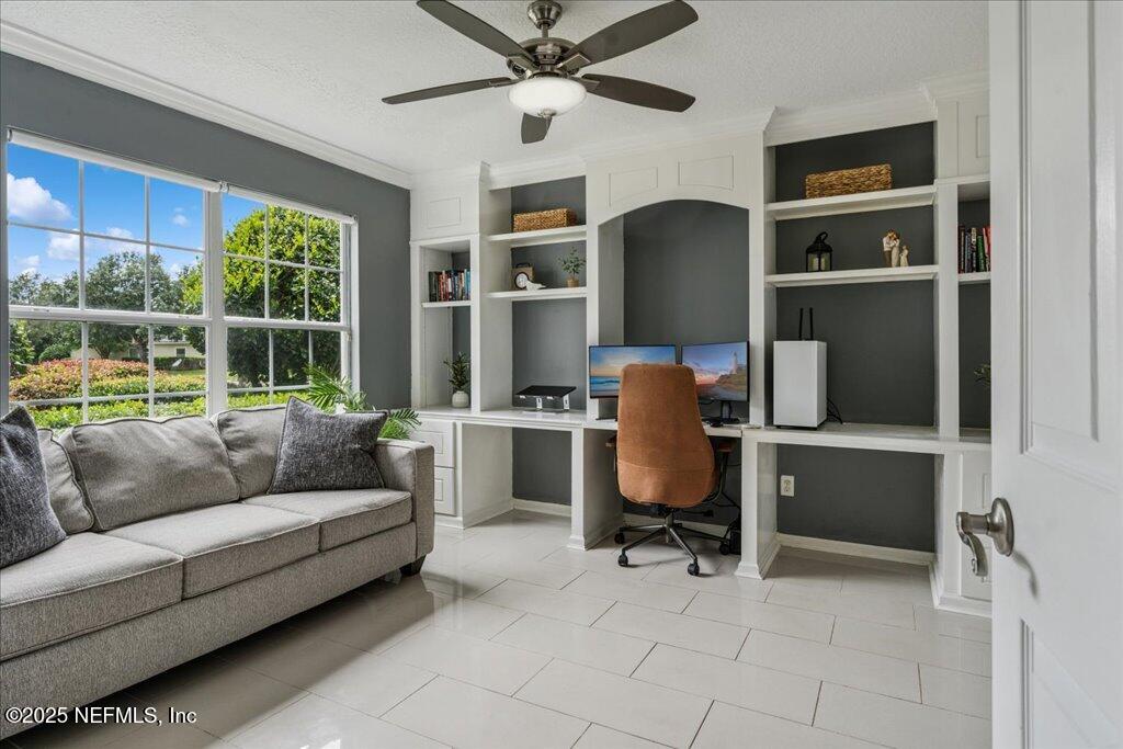 800 Marjories Way St. Augustine, FL 32092 - Photo 13 of 38 a view of a livingroom with workspace and a couch