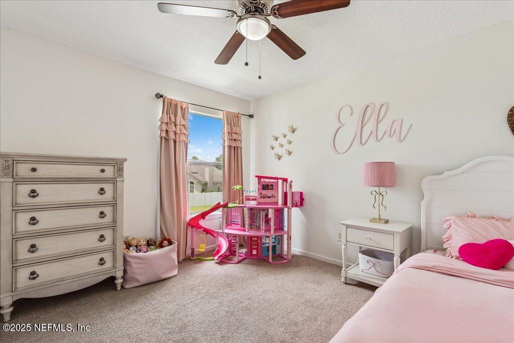 800 Marjories Way St. Augustine, FL 32092 - Photo 16 of 38 a bedroom with a bed and a window