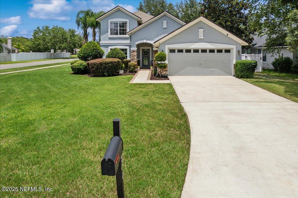 800 Marjories Way St. Augustine, FL 32092 - Photo 18 of 38 a view of a house with a yard and potted plants