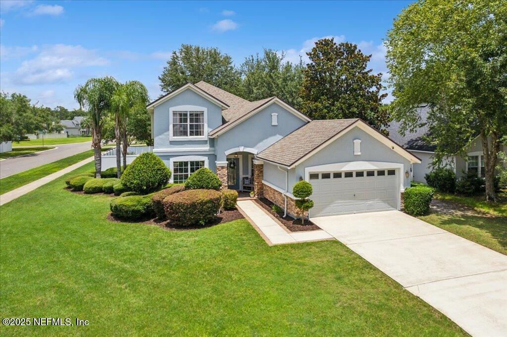 800 Marjories Way St. Augustine, FL 32092 - Photo 19 of 38 a house view with a garden space