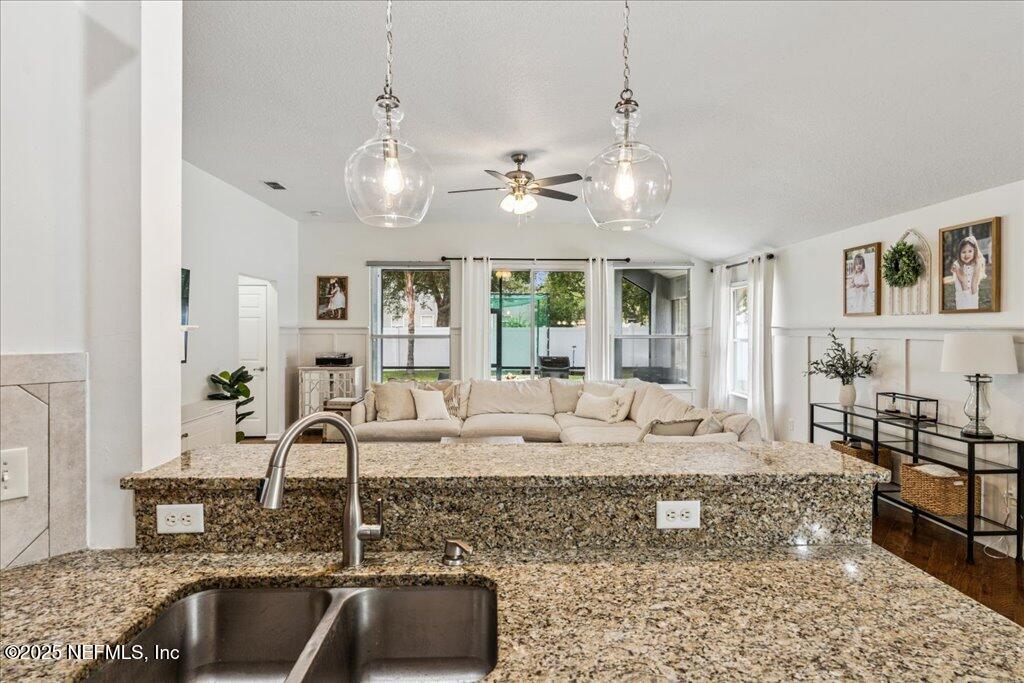 800 Marjories Way St. Augustine, FL 32092 - Photo 23 of 38 a living room with granite countertop furniture and a chandelier