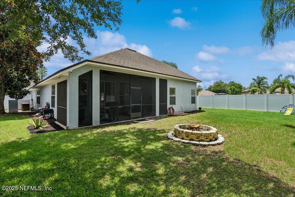 800 Marjories Way St. Augustine, FL 32092 - Photo 28 of 38 a front view of a house with a yard