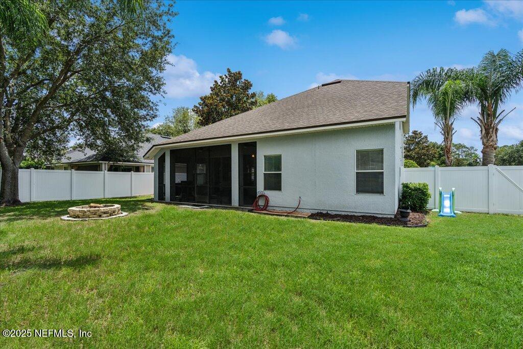 800 Marjories Way St. Augustine, FL 32092 - Photo 29 of 38 a view of a house with a yard