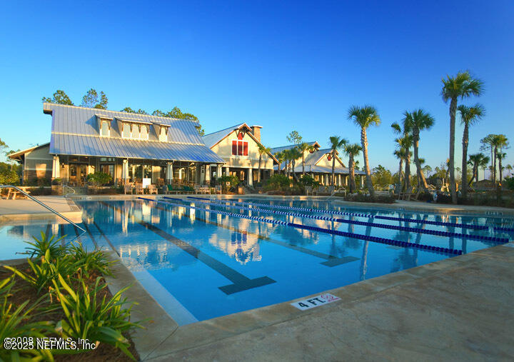 800 Marjories Way St. Augustine, FL 32092 - Photo 30 of 38 a view of a swimming pool with outdoor seating