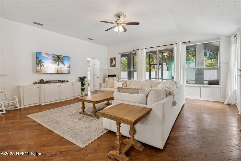 800 Marjories Way St. Augustine, FL 32092 - Photo 3 of 38 a living room with furniture and a flat screen tv