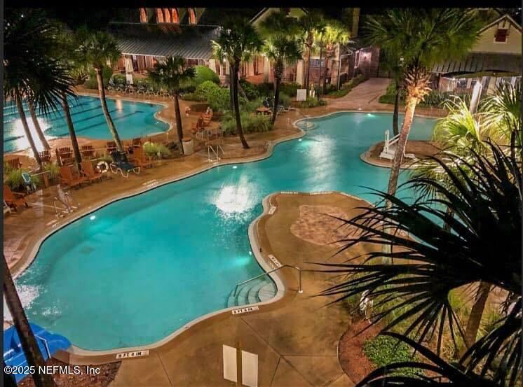 800 Marjories Way St. Augustine, FL 32092 - Photo 32 of 38 an aerial view of a swimming pool with a yard
