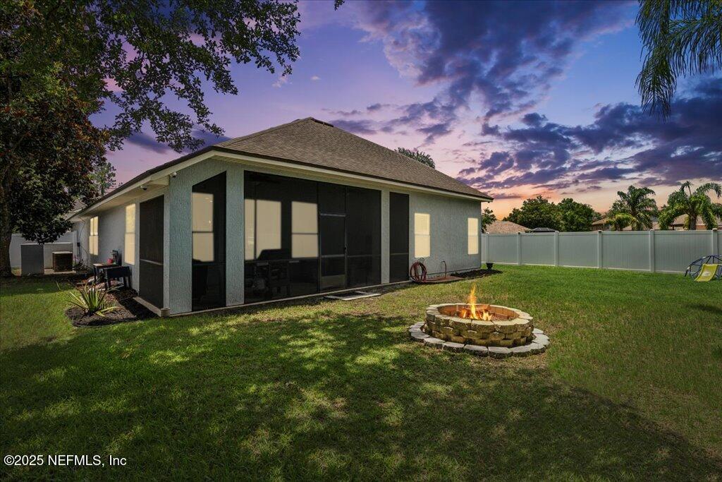 800 Marjories Way St. Augustine, FL 32092 - Photo 4 of 38 a front view of a house with a yard