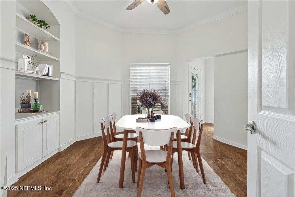 800 Marjories Way St. Augustine, FL 32092 - Photo 6 of 38 a view of a dining room with furniture and wooden floor
