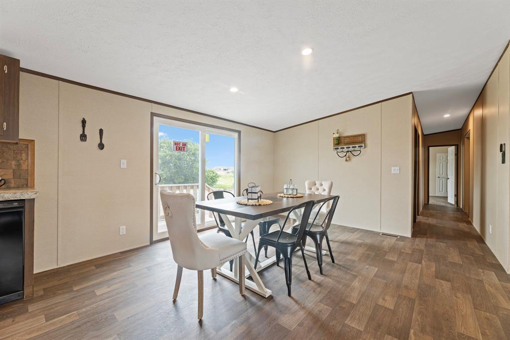 200 El Dorado Street Decatur, TX 76234 - Photo 17 of 31 a view of a dining room with furniture window and wooden floor