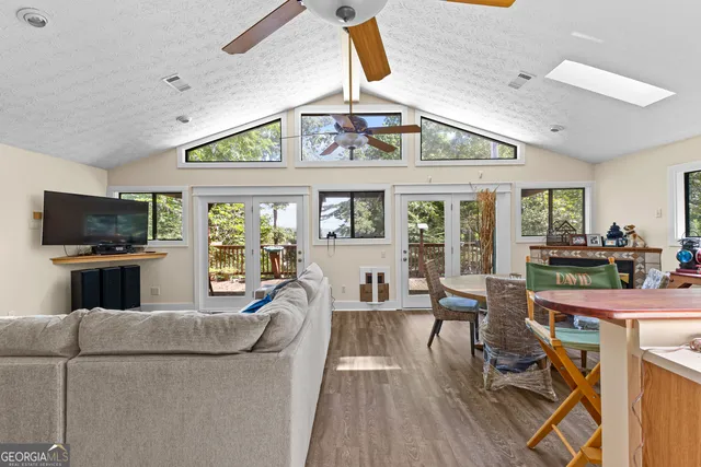 a kitchen with a refrigerator window and cabinets