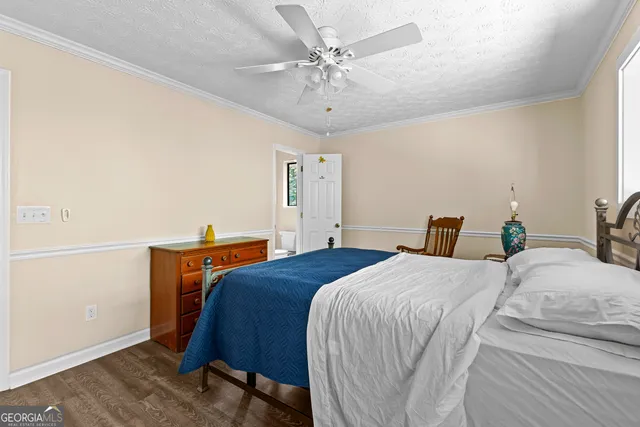 a bathroom with a shower and a toilet