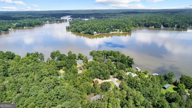 an aerial view of a houses with ocean view