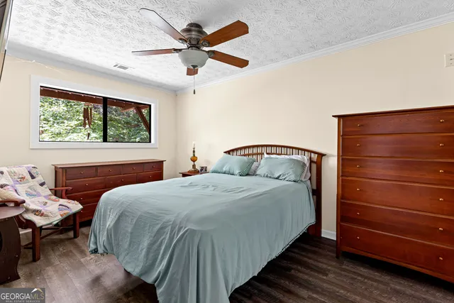 a bathroom with a sink toilet a mirror and bathtub
