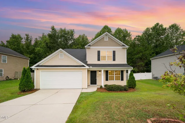 front view of a house with a yard