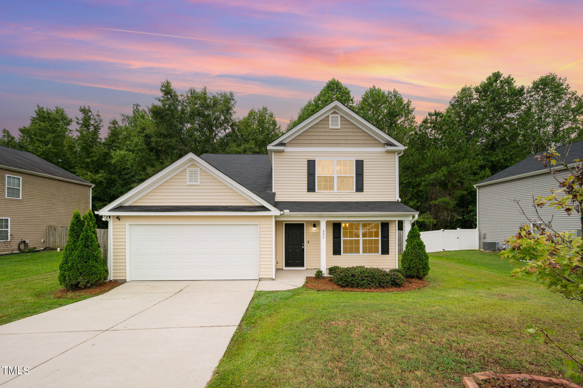front view of a house with a yard