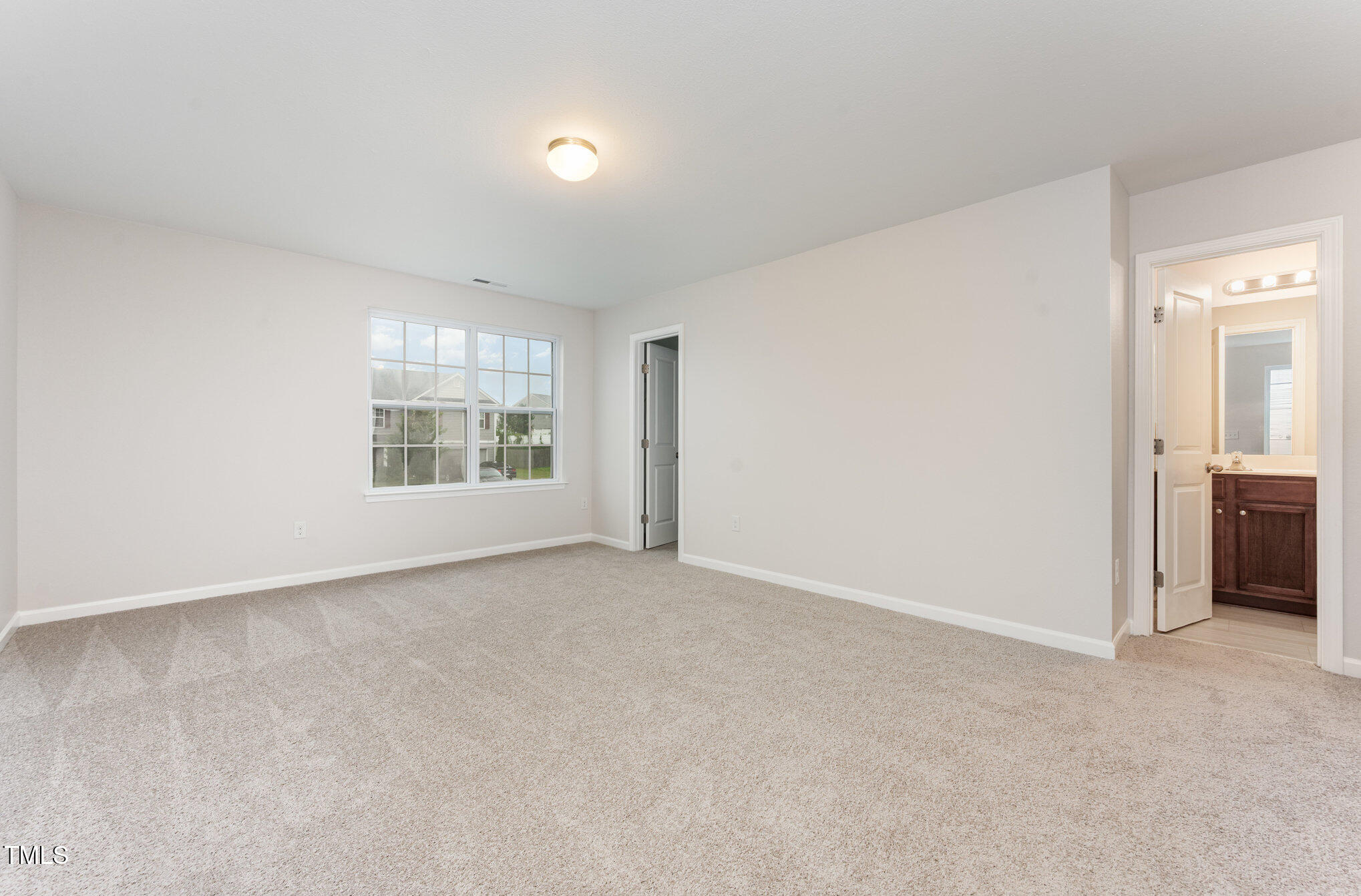 356 Botanical Court Bunnlevel, NC 28323 - Photo 15 of 31 an empty room with windows and closet