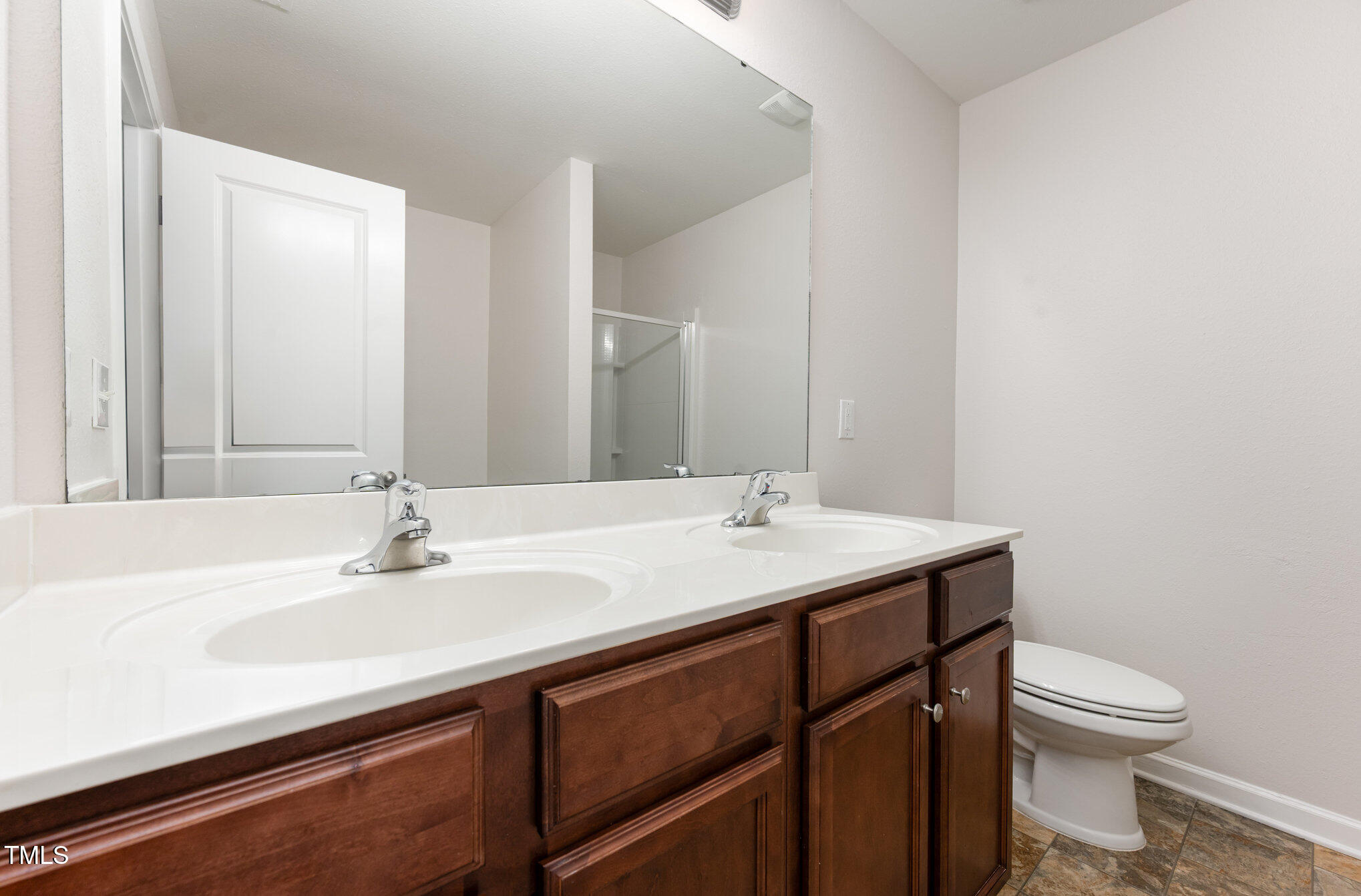 356 Botanical Court Bunnlevel, NC 28323 - Photo 20 of 31 a bathroom with a sink double vanity and a toilet
