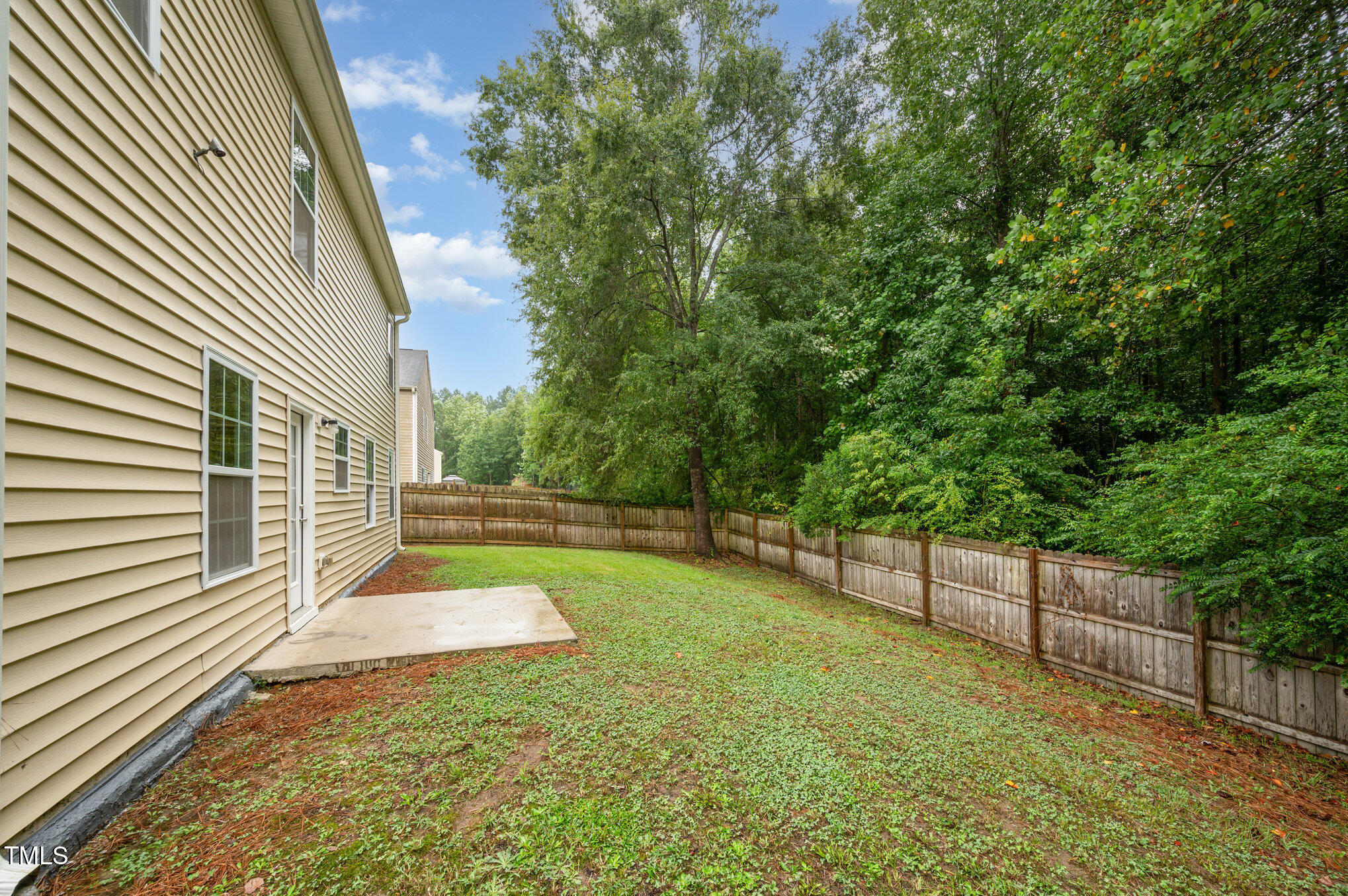 356 Botanical Court Bunnlevel, NC 28323 - Photo 26 of 31 a view of a backyard with wooden fence