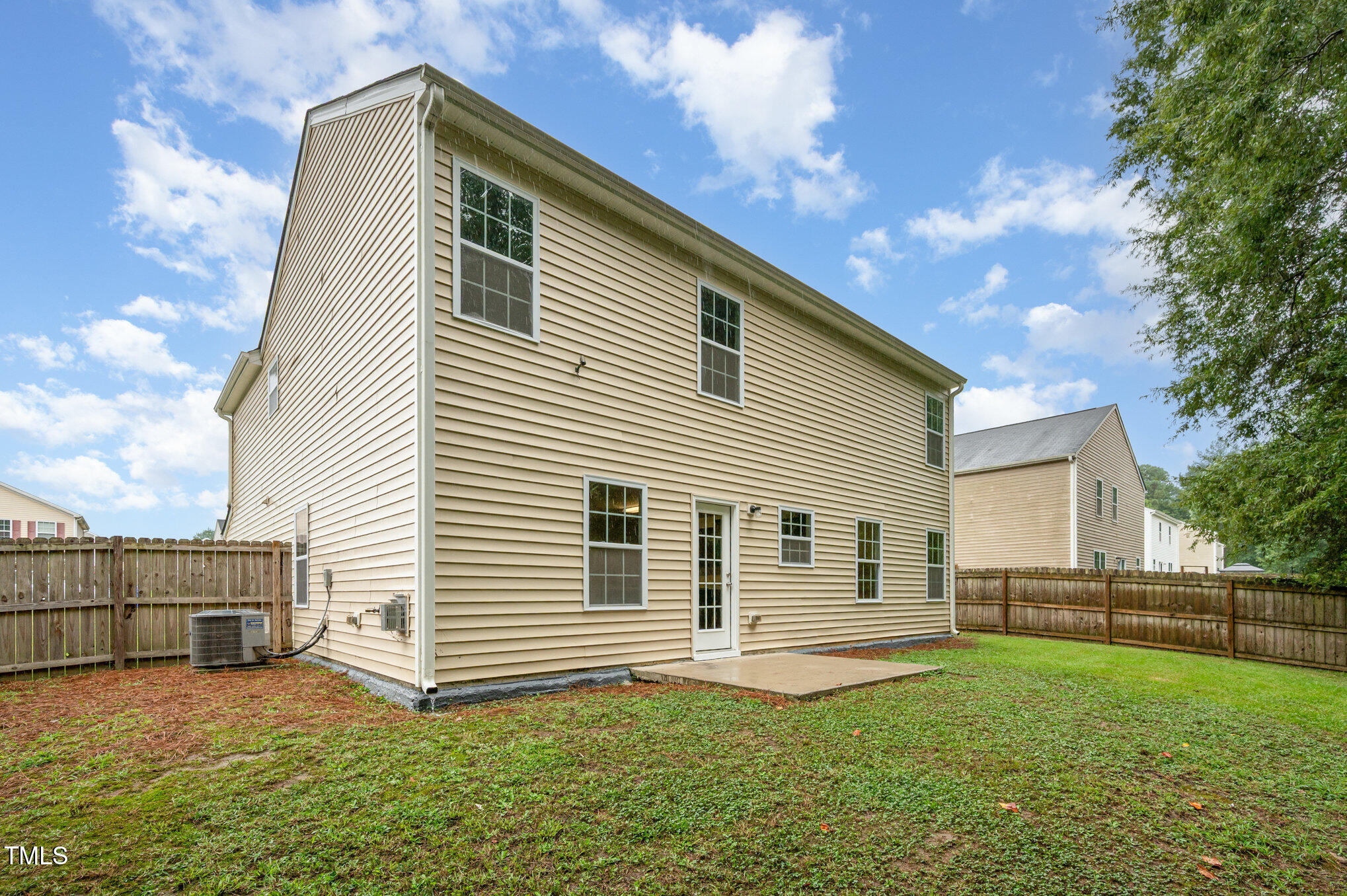 356 Botanical Court Bunnlevel, NC 28323 - Photo 28 of 31 a backyard of a house with lots of green space