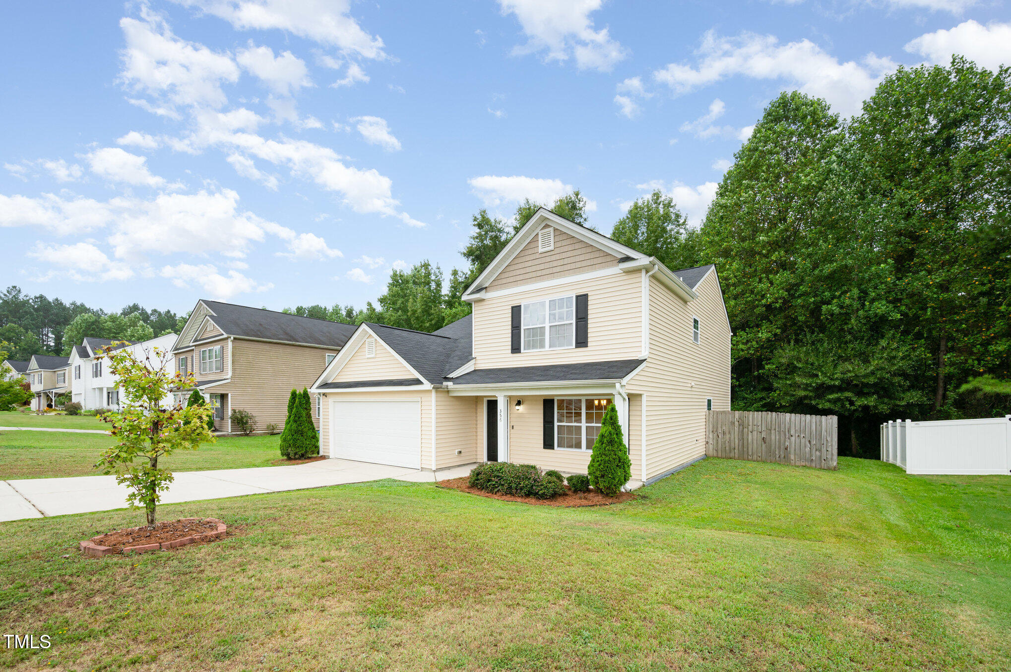356 Botanical Court Bunnlevel, NC 28323 - Photo 3 of 31 a front view of a house with a yard