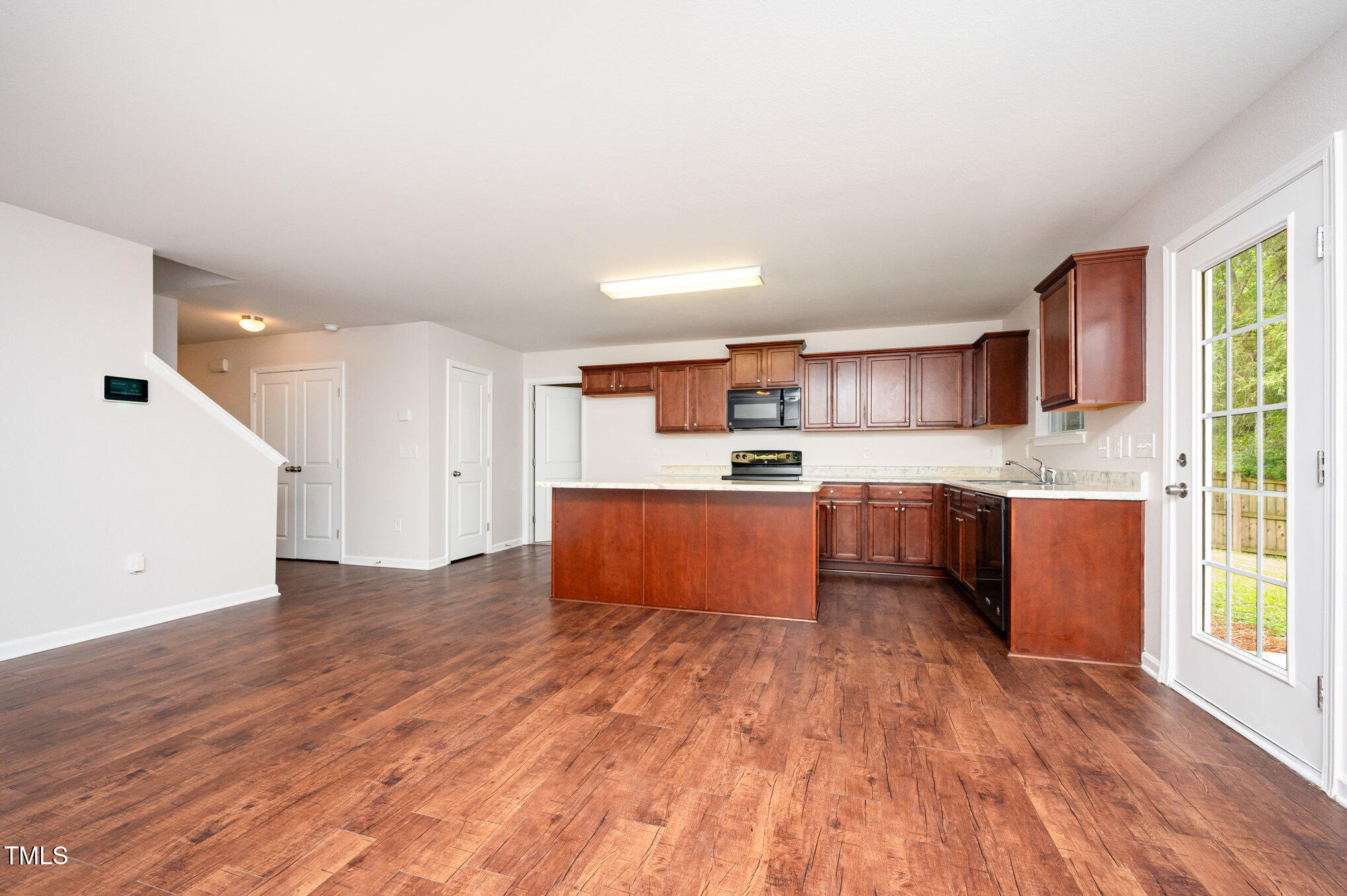 356 Botanical Court Bunnlevel, NC 28323 - Photo 8 of 31 a kitchen with stainless steel appliances kitchen island wooden cabinets and granite counter tops