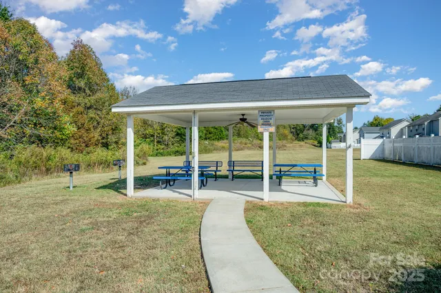 a view of a swimming pool with a yard