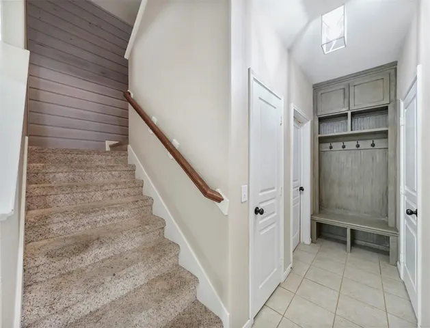 a view of a hallway with closet and entryway
