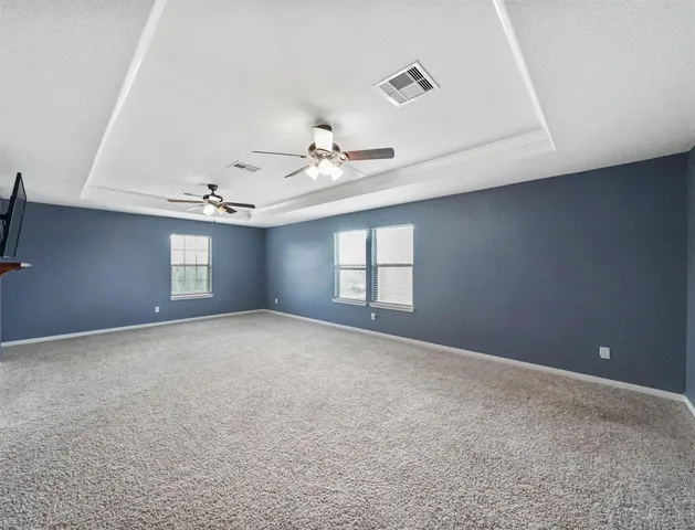 a view of empty room with windows