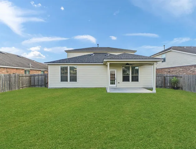 a view of a backyard with plants and a garden