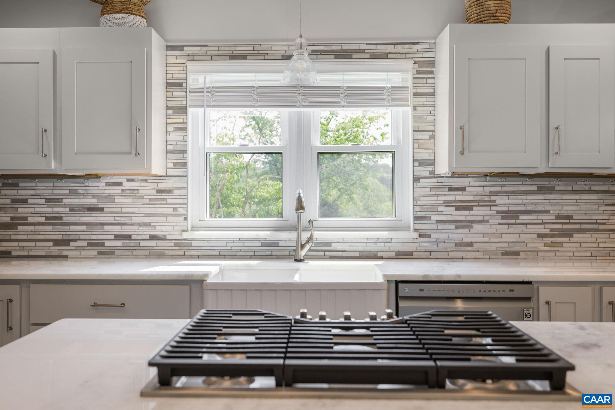 1701 Harrington Road Gordonsville, VA 22942 - Photo 14 of 28 a kitchen with granite countertop a stove and a sink