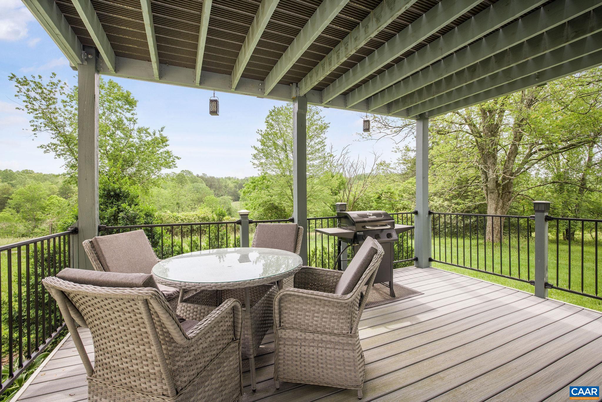 1701 Harrington Road Gordonsville, VA 22942 - Photo 16 of 28 a view of a patio with a table chairs and a patio