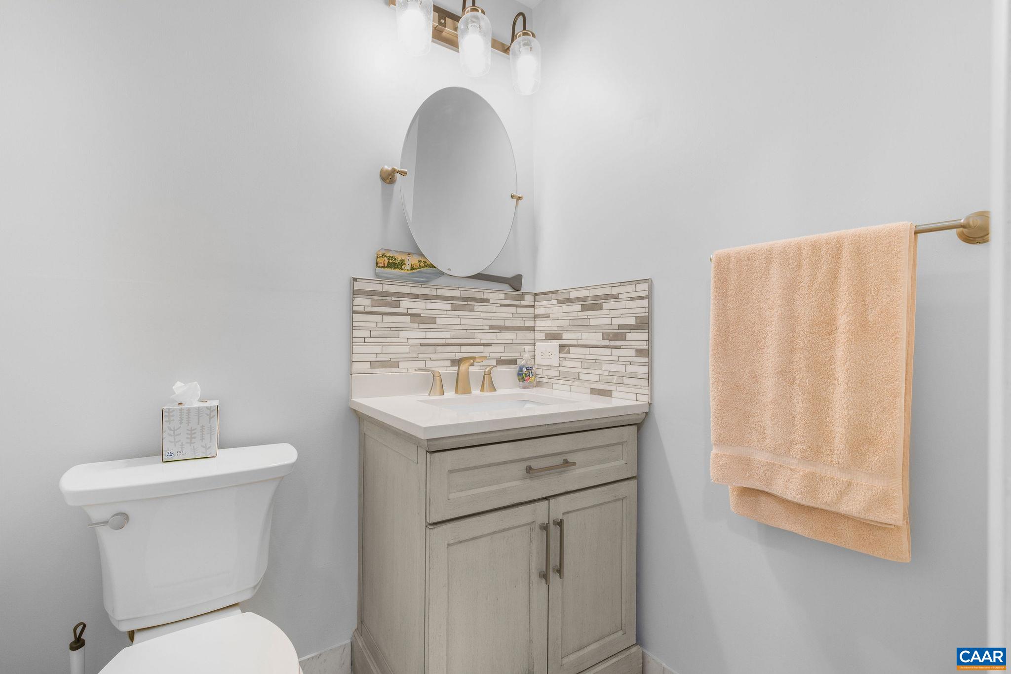 1701 Harrington Road Gordonsville, VA 22942 - Photo 17 of 28 a bathroom with a toilet sink and mirror