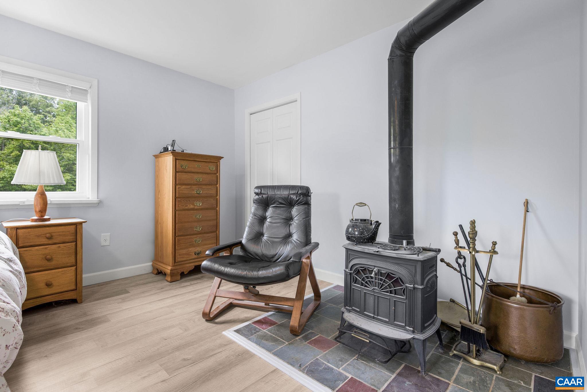 1701 Harrington Road Gordonsville, VA 22942 - Photo 19 of 28 a view of a workspace with furniture and a window