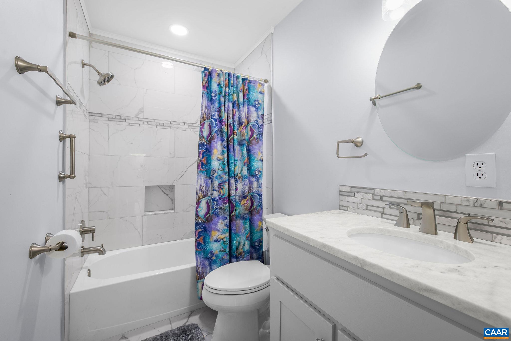 1701 Harrington Road Gordonsville, VA 22942 - Photo 25 of 28 a bathroom with a sink a toilet and a bathtub