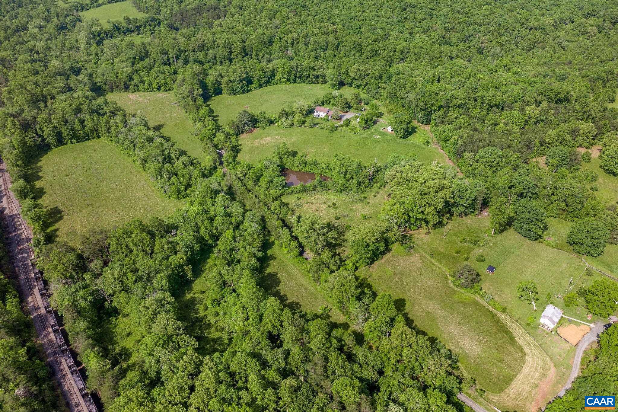 1701 Harrington Road Gordonsville, VA 22942 - Photo 27 of 28 a view of a lush green forest with lots of trees